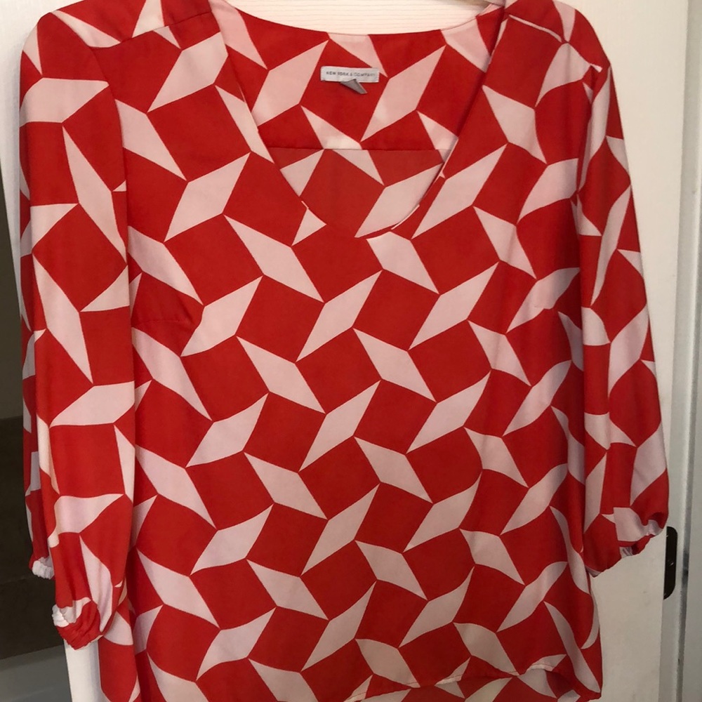 Orange and white geo print top
